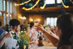 People giving a toast at a barn wedding reception